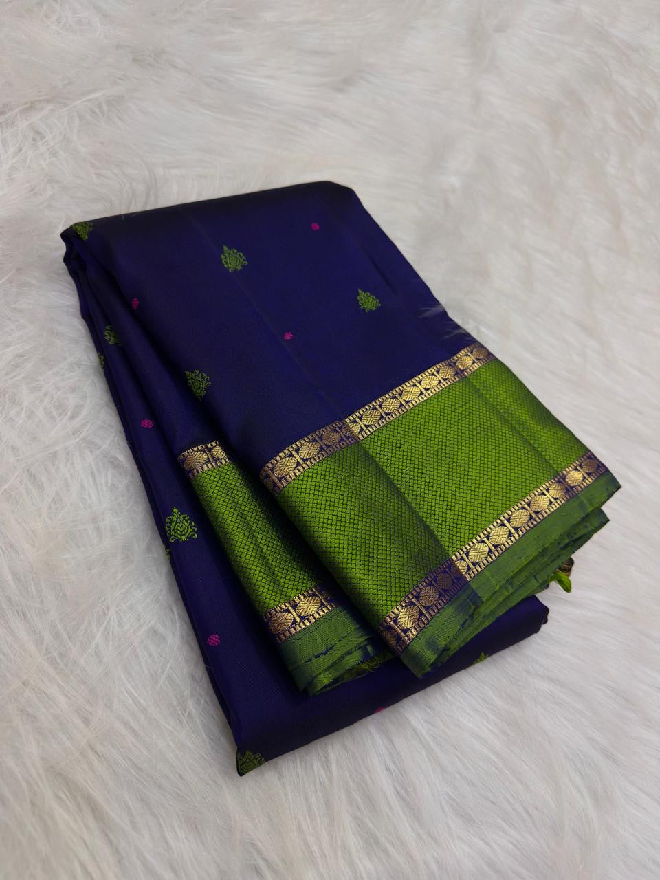 Vivid leaf-green Kanchipuram border showing delicate geometric gold zari texture and floral-leaf registers.
