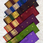 Border edge showing ilai pachai with orange selvedge and finely finished zari selvedge on Kanchipuram silk