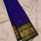Zari detail of the ornate border and pallu on indigo and bottle green silk saree