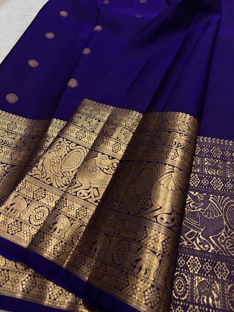 Pure silk Kanchivaram Butta saree with grand Yazhi-inspired antique gold zari border panels