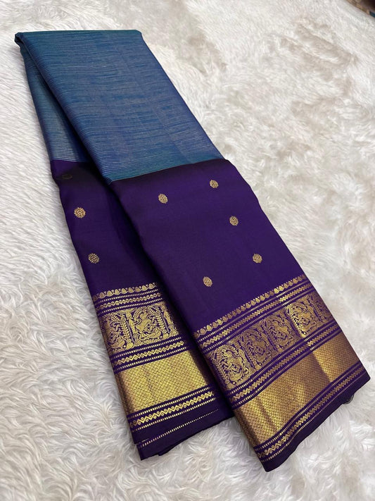Traditional blue Kanchi pattu saree with korvai antique gold border