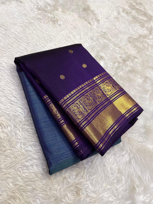 Traditional Indira Neelam blue Kanchi pattu saree with Vadamalli purple korvai border and antique gold zari