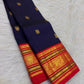 Ink Navy Blue pure silk Kanjivaram Varisaipet saree with Vermilion Red and antique-gold zari border.