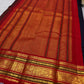 Deep navy pure mulberry silk Kanjivaram saree with small spaced traditional gold zari motifs.