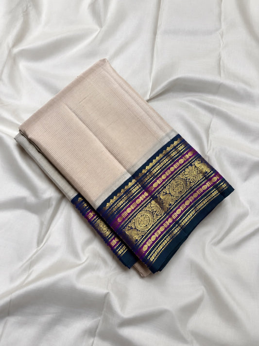 Ivory and blue handwoven Pure Silk Kanchipuram saree with peacock double shade border detailing