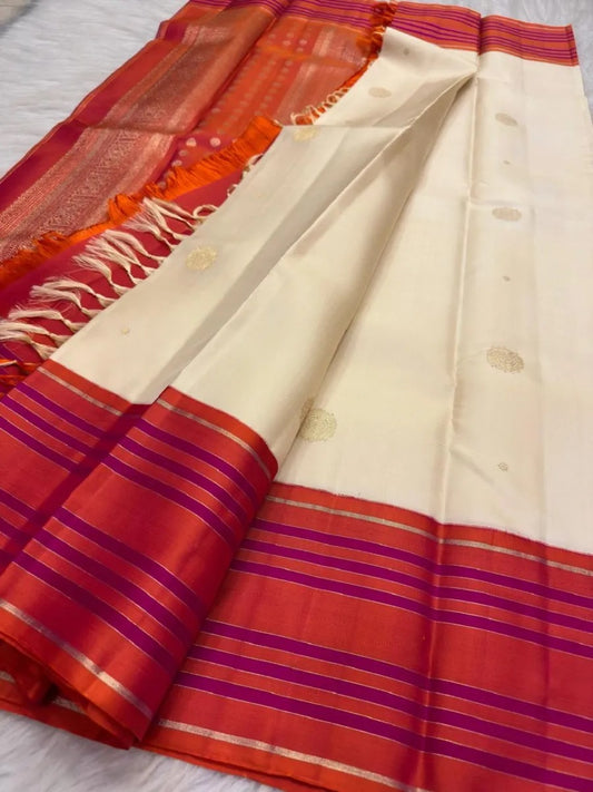 Warm ivory and sunset coral handwoven Pure Silk Kanchipuram saree with double shade border