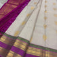 Flat lay of pearl silver pure Kanchipuram silk saree with gold paisley buttas and magenta zari border, shipped from New Jersey USA