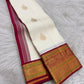 Mughal-inspired floral butta in gold-tone zari woven on pale ivory Kanchipuram silk
