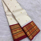 Contrast of pale ivory pure silk and deep Arakku red zari border
