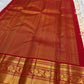 Ivory Korvai saree showing the broad Arakku red and gold zari border against the pale silk body.