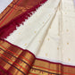 Close view of Kalam paisley buttas on the ivory silk body of a Kanchipuram saree