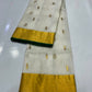 Close-up of small gold-tone woven motifs scattered across the Ivory Katan Silk Chanderi saree body.
