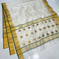 Ivory handloom Chanderi saree showing gold woven motifs, Emerald Green edged gold border and decorative pallu.