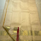 Deep Pink selvedge outlining the pale Kanchipuram body.