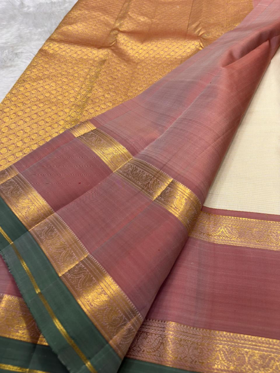 Kanchipattu silk saree in ivory cream with dusty rose border Korvai Rettapet weave traditional zari detail