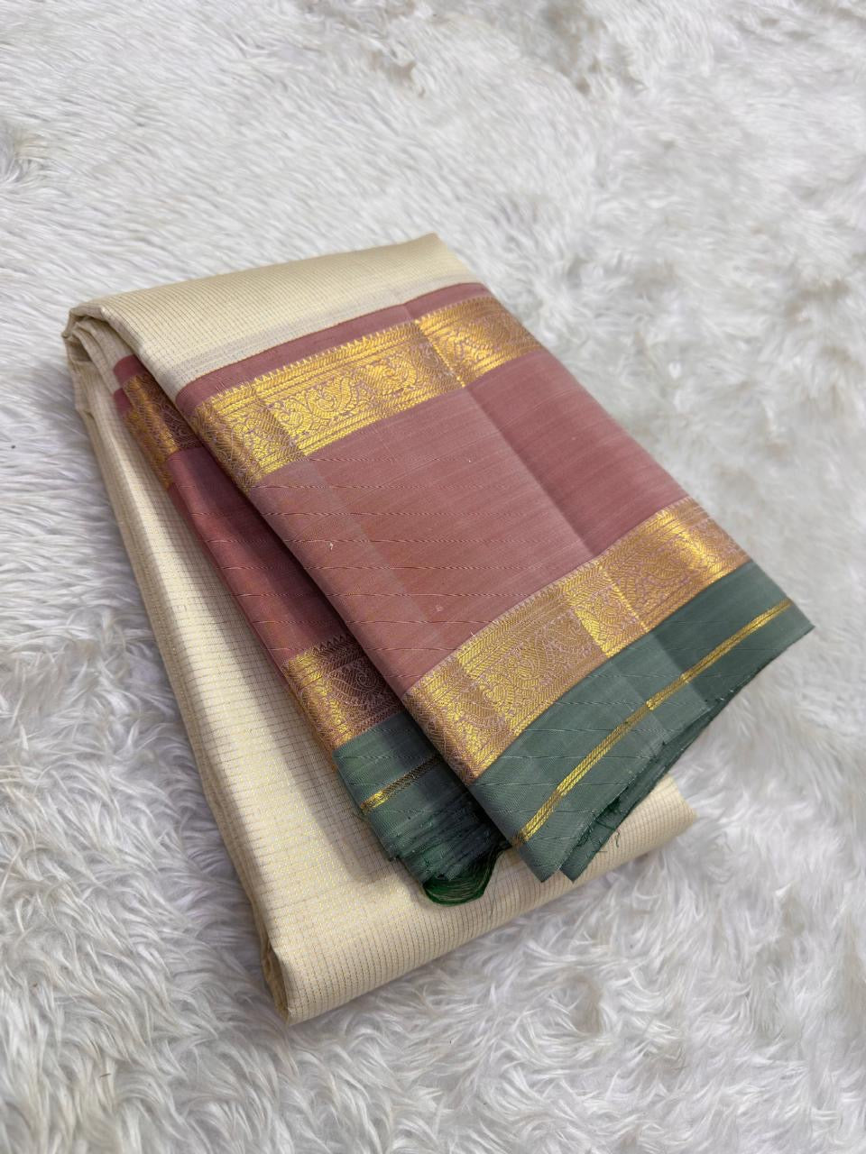 Kanchipattu silk saree in ivory cream with dusty rose border Korvai Rettapet weave traditional zari detail