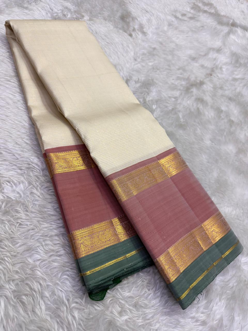 Kanchipattu silk saree in ivory cream with dusty rose border Korvai Rettapet weave traditional zari detail