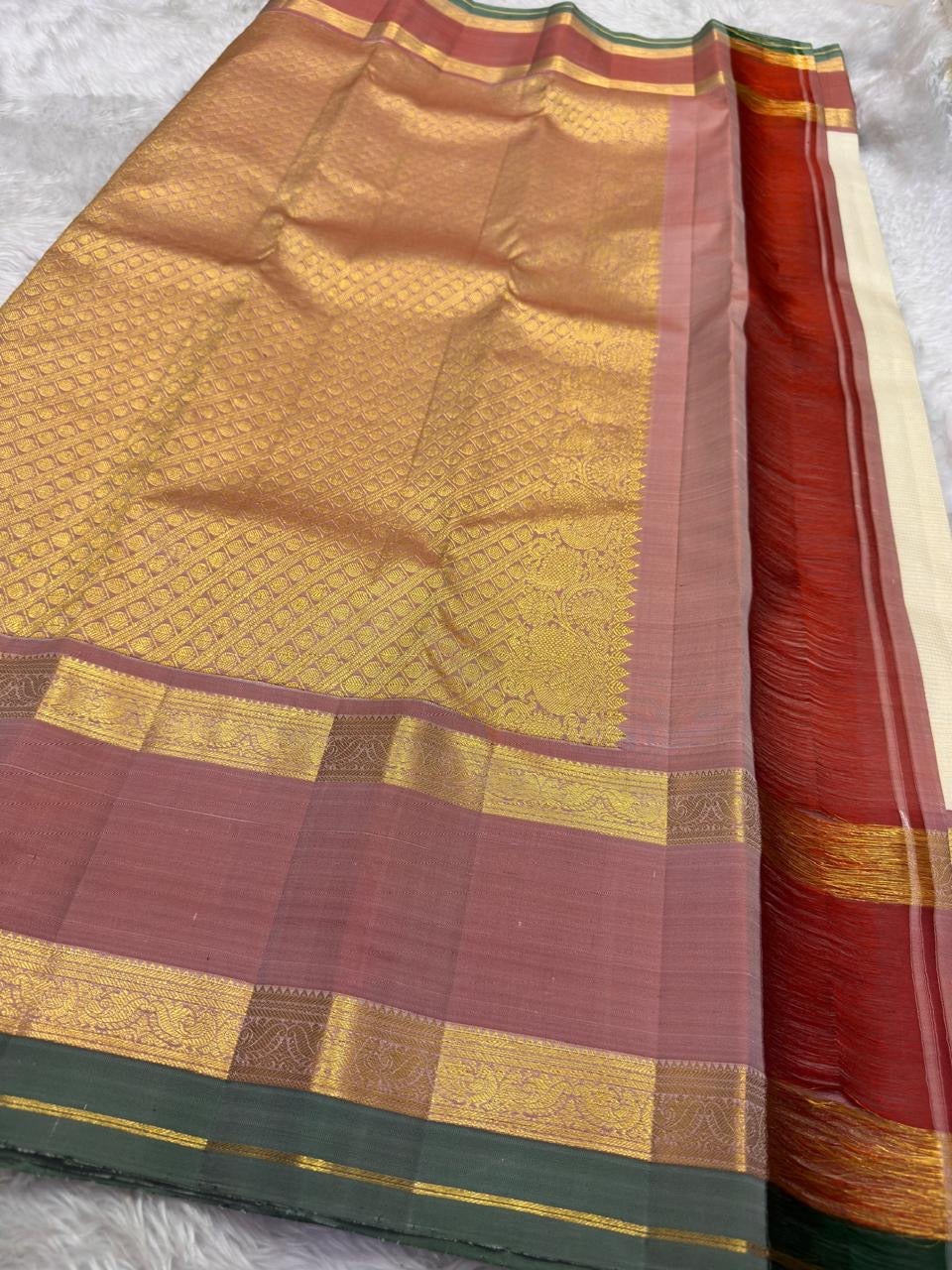 Kanchipattu silk saree in ivory cream with dusty rose border Korvai Rettapet weave traditional zari detail
