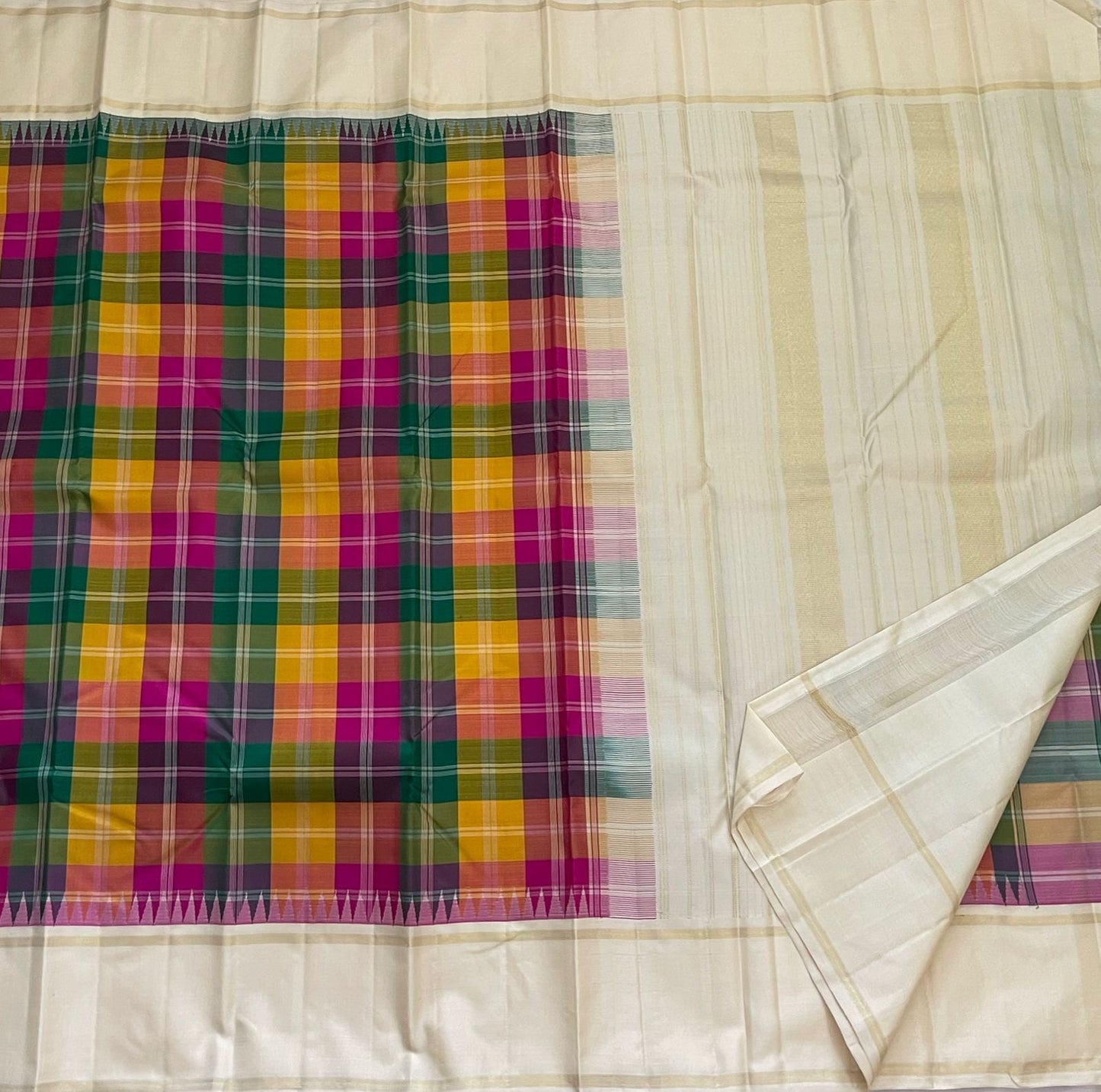 Ivory cream Kanchipattu saree with turmeric yellow and rani pink checks detail
