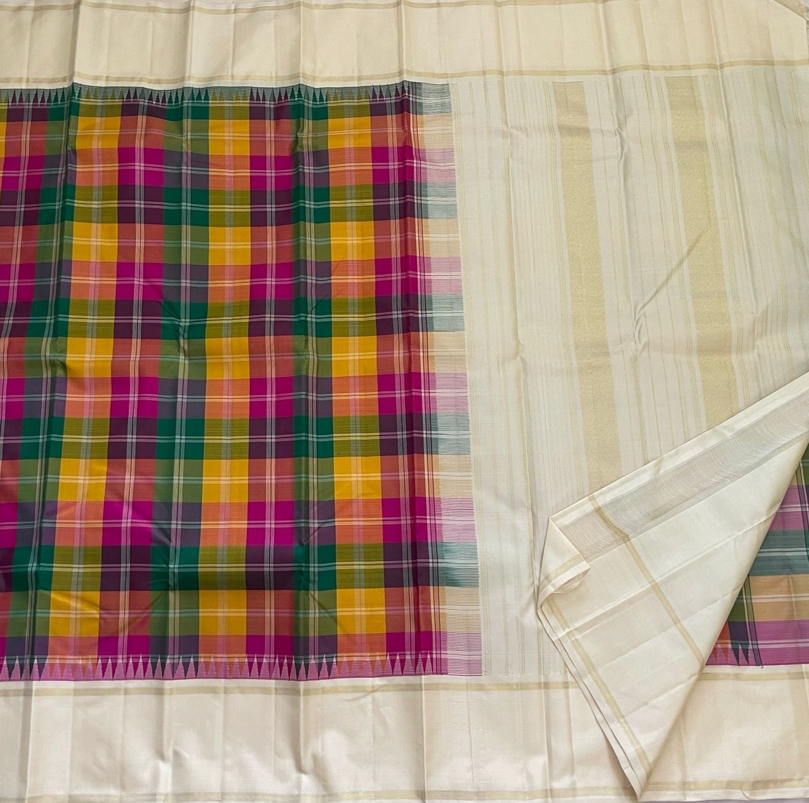Ivory cream Kanchipattu saree with turmeric yellow and rani pink checks detail