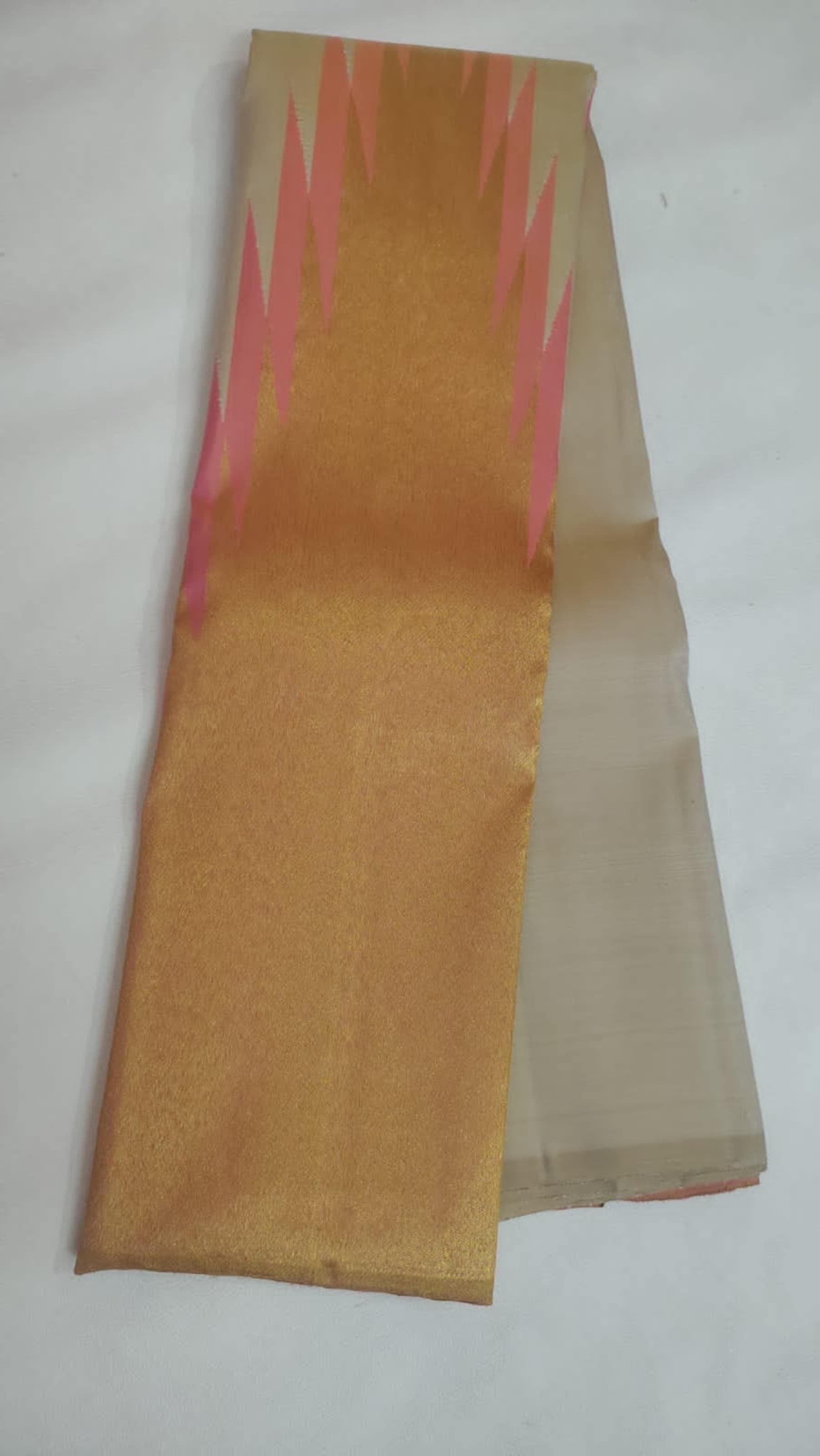 Close view of Ettukol body showing eight-shuttle layered interlacements on ivory silk