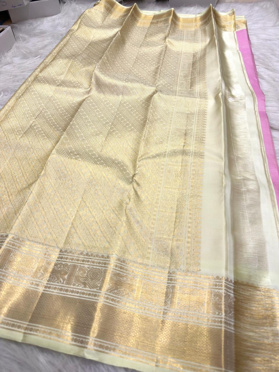 Rose Pink Korvai saree with delicate gold buttas and luminous ivory border