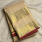 Tiny gold-zari buttas across Soft Ivory silk.