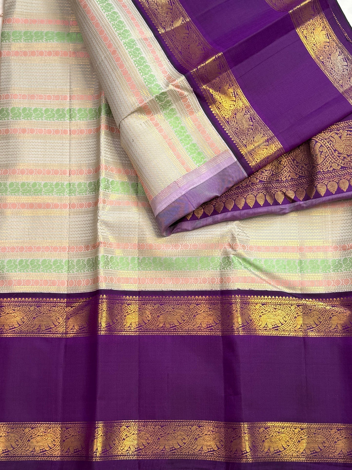 Ivory Veldhari Kanchipuram pure silk with green and pink silk-thread motifs and fine gold zari