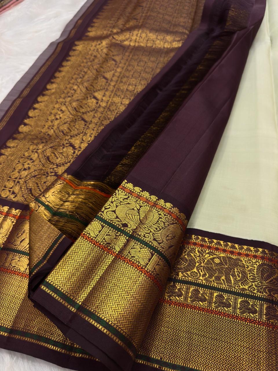 Ivory Green Undertone Handwoven Pure Silk Kanjipuram Saree with Aubergine Korvai Mayil Zari Border