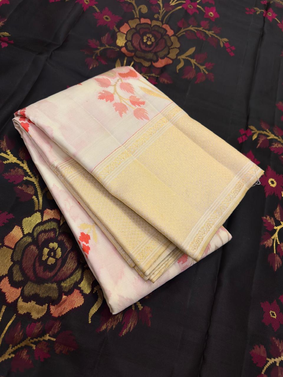 Pearl Ivory Kanchipuram saree with layered rose coral and sage botanical zari work.