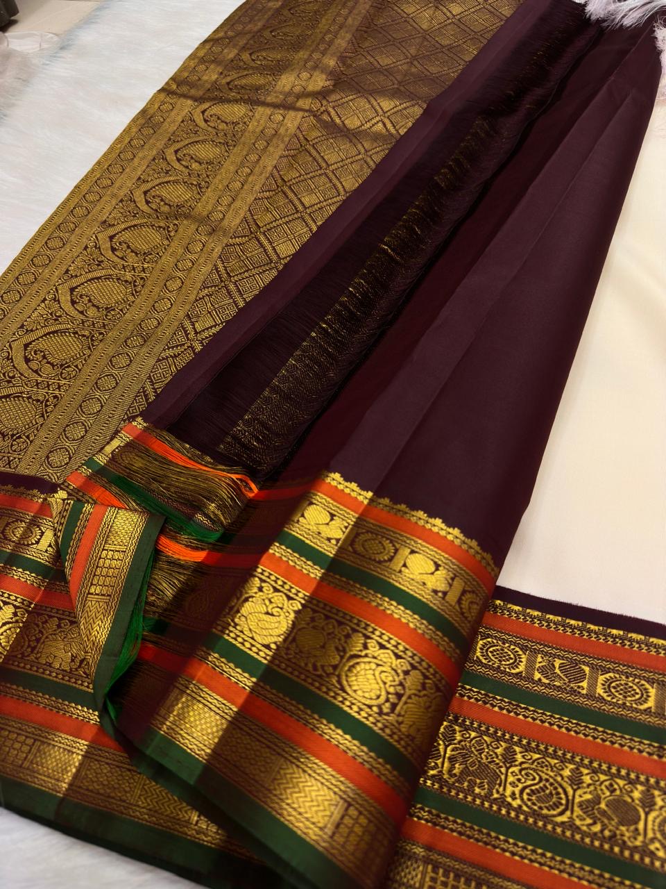 Kanjeevaram pure silk varisaipet saree in ivory with richly woven traditional pallu