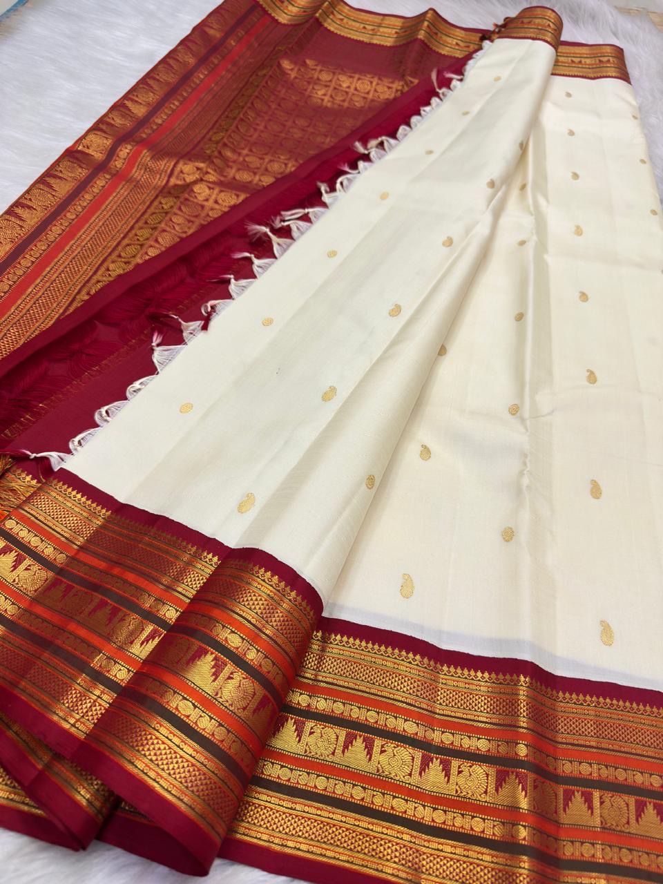 Soft ivory handwoven silk body with deliberately spaced zari motifs