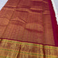 Ivory and Arakku contrast across handwoven pure silk and ornate zari border