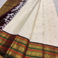 Ivory pure silk Kanchipuram saree with Mayil Chakram buttas and ornate varisaipet border