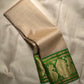Close-up of gold zari buttas on soft ivory Kanjipuram silk saree body