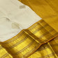 Venpattu Ivory Pure Silk Kanchipuram Butta Saree with Manjal Gold Pettu
