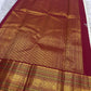 Arakku red border and richly worked pallu of an ivory Pure Silk Kanchipuram saree.