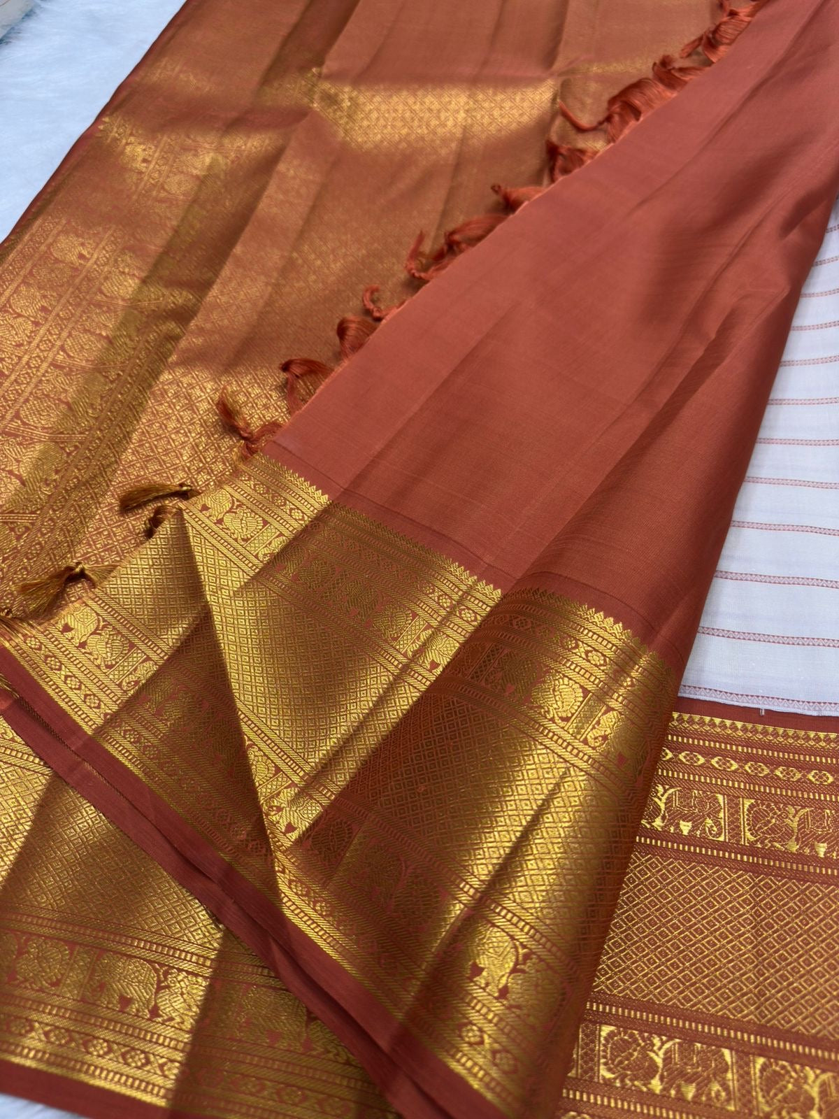 Warm-ivory pure silk Kanjipuram Korvai saree, folded view — Idam Living