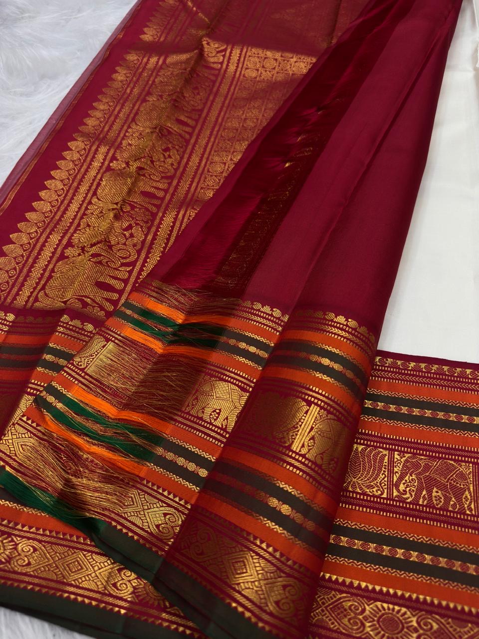 Ivory Kanjivaram Varisaipet saree, vermilion red border with elephant motifs detail