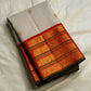 Folded ivory Pure Kanchipuram Silk Saree with small gold buttas and zari border with red edge