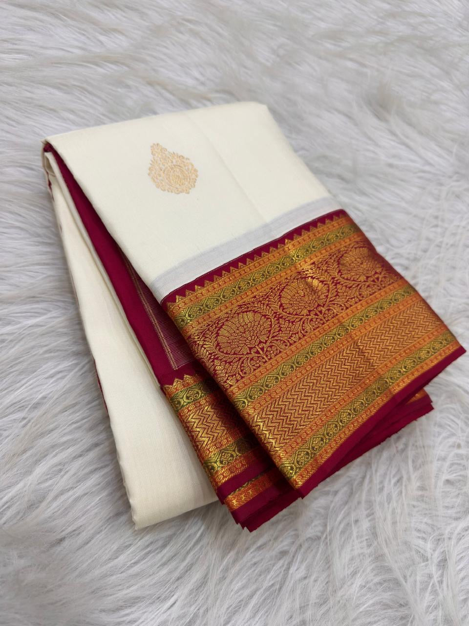 Full view of ivory Varisaipet Kanjipuram silk with Arakku red Mughal floral zari border