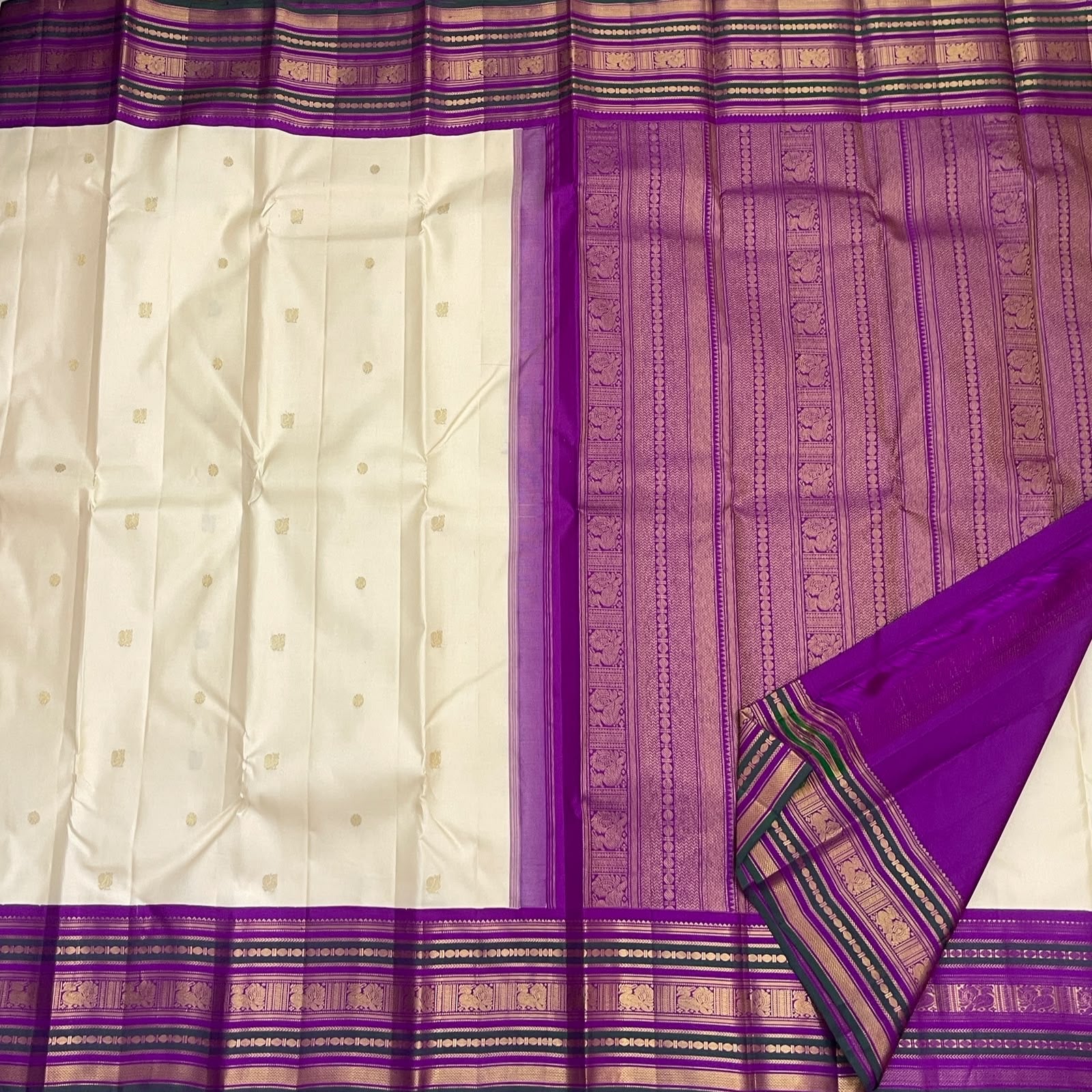 Warm Ivory Kanjivaram saree with intricate Royal Purple traditional zari border