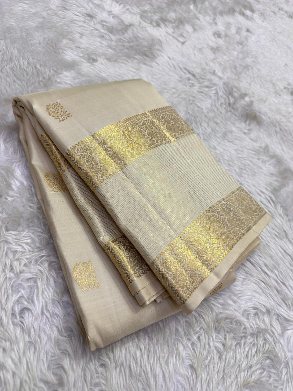 Warm Ivory Kanjivaram silk saree with gold zari bird-motif border