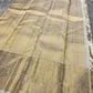 Ivory Handwoven Pure Silk Kanjivaram Saree with Gold Zari Buttas and Ornate Border – silk body weave close-up