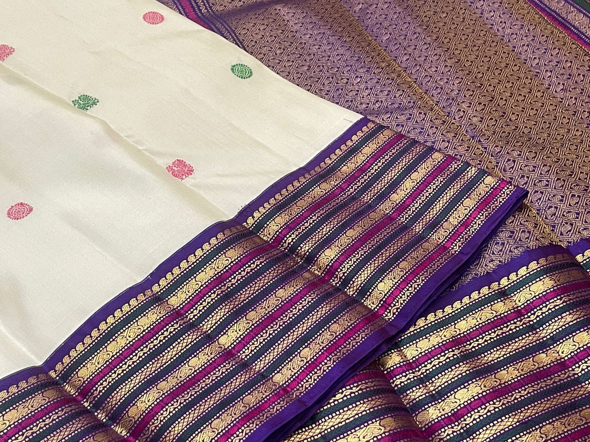 Warm Ivory Kanjivaram saree with all-over coloured silk thread motifs
