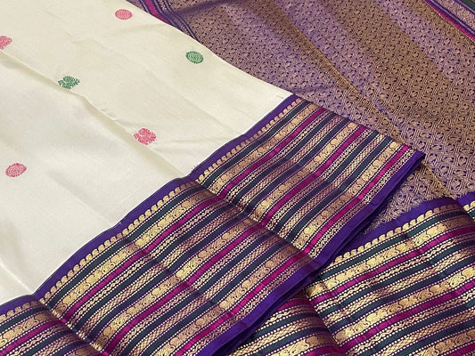 Warm Ivory Kanjivaram saree with all-over coloured silk thread motifs