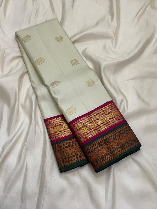 Sandalwood Ivory Handwoven Pure Silk Kanjivaram Korvai Saree with Peacock and Elephant Motifs, folded saree presentation