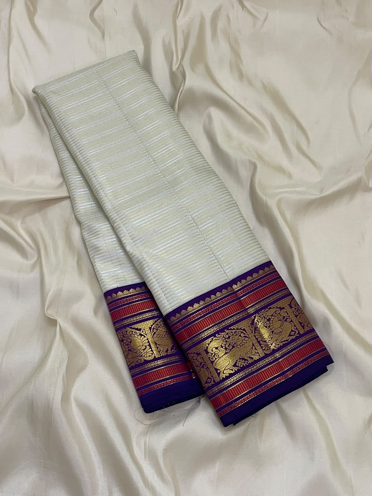 Warm Ivory Handwoven Pure Silk Kanchipuram Saree with Purple Border and Veldhari Detail, contrasting border detail