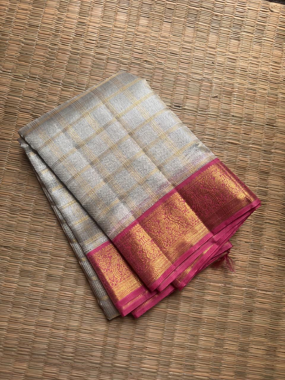 Ivory Kora silk Kancheepuram saree with delicate gold Kattam grid.