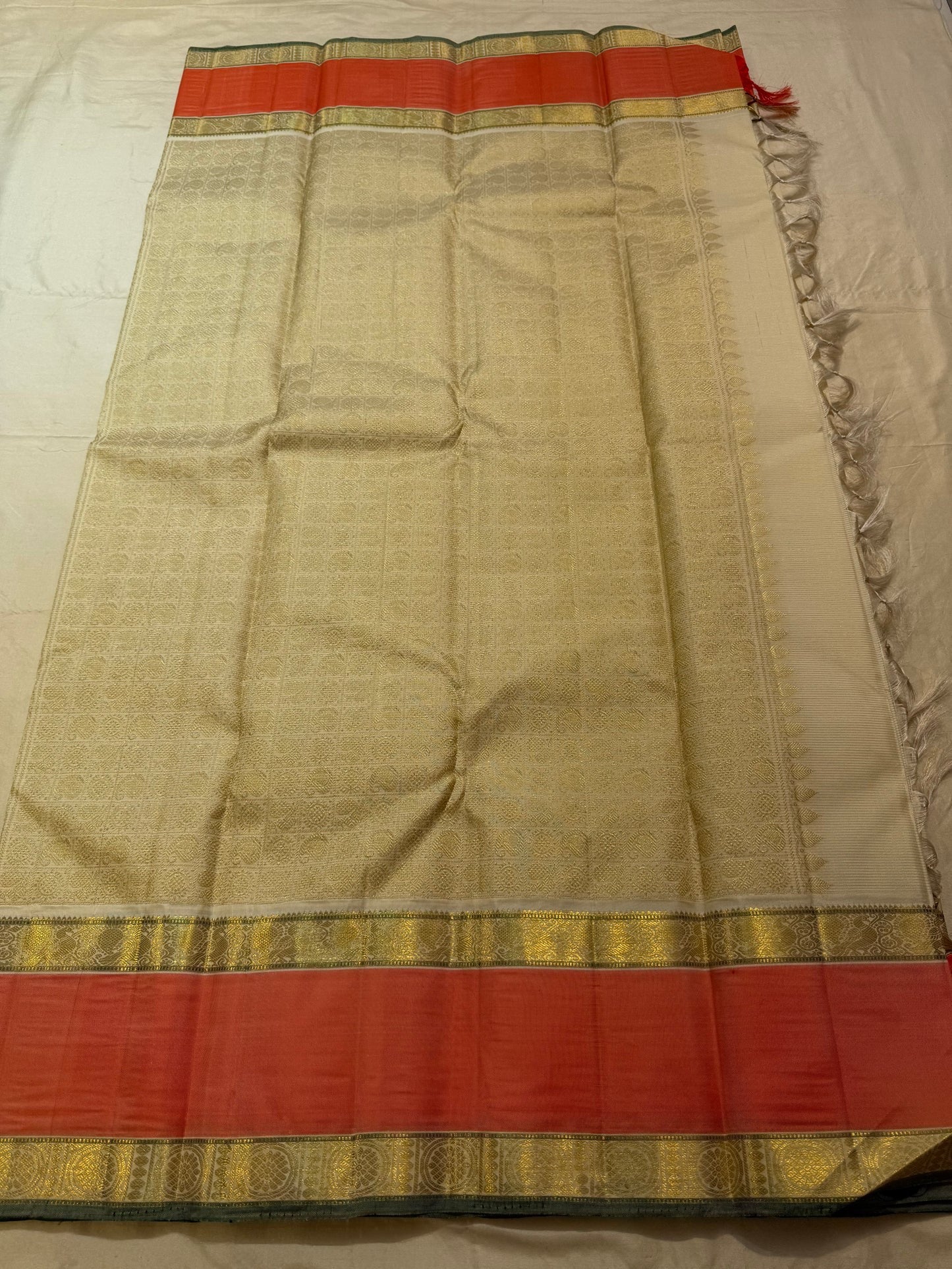 Folded view of off white and cinnamon red vairaoosi Kanjivaram silk saree — Idam Living